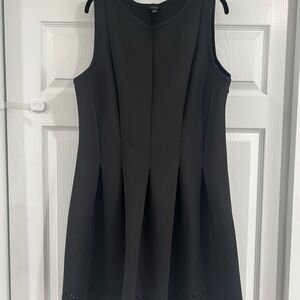 Elegant Black Sleeveless Dress with Geometric Eyelet Detail